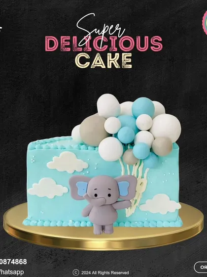 A whimsical elephant-themed cake for a baby's milestone. This light blue cake is decorated with fluffy clouds and a cute elephant holding a bundle of balloons.