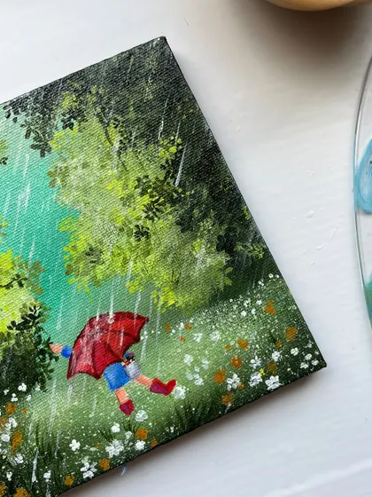 A close up of the child with the red umbrella. I love the feeling of joy and freedom in this little character.