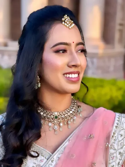 Keerthi looking absolutely radiant for her reception. We chose soft pink tones for her makeup to complement her delicate pink and white lehenga.