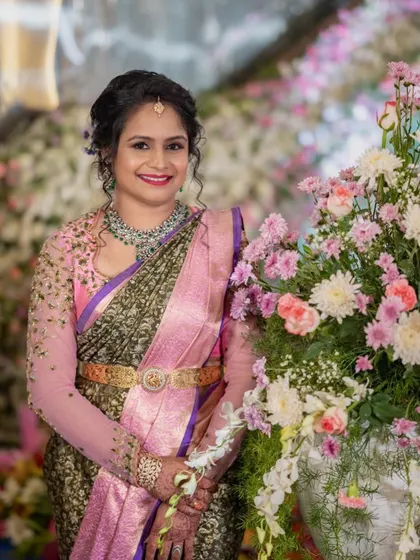 A beautiful client at a wedding reception. I designed her blouse with delicate, sheer embroidered sleeves for an elegant and modern touch.