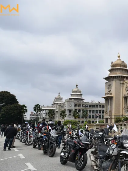 A lineup of bikes in front of the Vidhana Soudha, showcasing the scale of the World Tourism Day ride.
