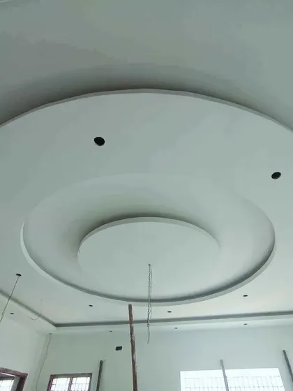 A simple and clean circular POP design, perfect for a minimalist bedroom or study. The holes for spotlights are pre-cut.