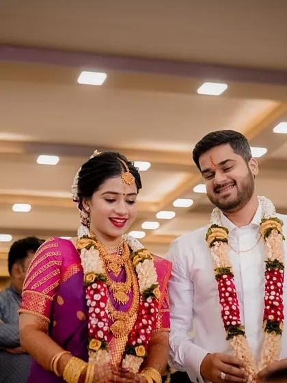 The newly engaged couple walks together, their smiles showing the happiness of the moment.