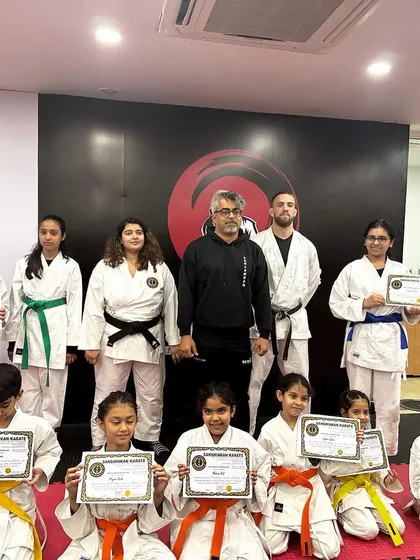 Our karate students proudly display their new belts and certificates after a successful belt test. We celebrate every milestone on their martial arts journey.