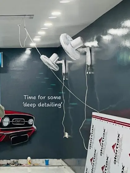 Here's a work-in-progress shot from the Deep Detailing House, showing the classic red car mural taking shape. This piece was designed to evoke a sense of speed and style.