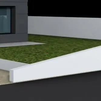 A minimalist landscape detail showing the clean transition between a paved surface, a raised lawn, and a white boundary wall. This approach creates a neat, uncluttered, and contemporary outdoor space.