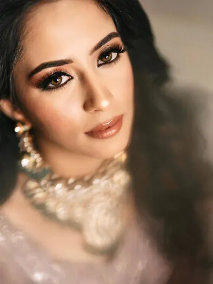 A close-up of this reception bride's beautiful eye makeup. The soft focus adds a dreamy, ethereal quality to the shot.