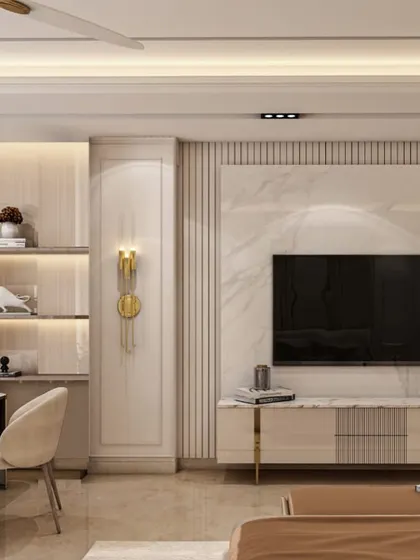 Here, we integrated a media unit and display shelving into the wall design. The television is mounted on a slab of marble, flanked by fluted panels and backlit shelves, turning a functional area into an elegant architectural feature.