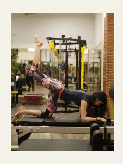 A graceful leg lift on the reformer. This move targets the glutes and hamstrings while challenging core stability.