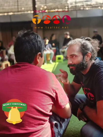 A quiet moment of connection between me and a participant during our Christmas community drum circle. These one-on-one interactions are just as important as the group rhythm.