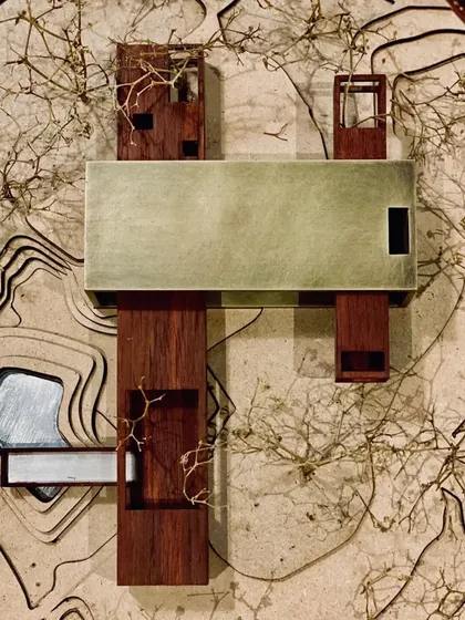 This handcrafted model shows a site specific insertion. We build these from wood and aged brass to feel the project with our hands. It is an exploration of how a building can be powerful yet sympathetic, strong yet soft, where art and soul intertwine.