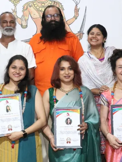 A group of graduates from the Aerial Yoga and Sound Healing courses. Their smiles reflect the joy and sense of accomplishment from their hard work.