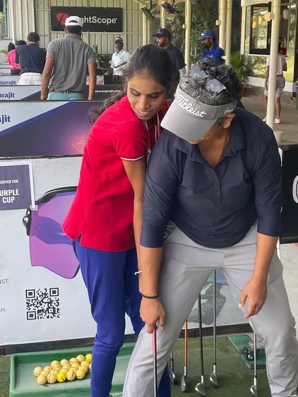 Guiding a student through the initial phase of her swing. My hands-on coaching for visually impaired golfers focuses on creating a feel for the correct movement and sequence.