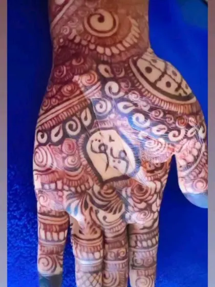A close-up of a beautiful, dark henna stain on the palm. The palm always takes the color the darkest, and this shows the amazing results of my natural henna.