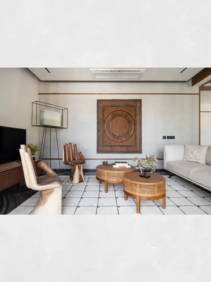 Another angle of the guest lounge, showing the careful curation of furniture and art to create a space that is both relaxing and visually engaging.