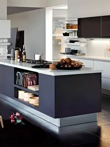 A minimalist island kitchen with dark and white cabinets and open shelving for a clean, gallery-like feel.