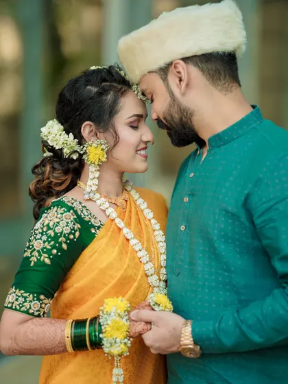 A close-up, intimate portrait of a Maharashtrian couple. The soft light and gentle expressions make this a timeless and romantic shot.