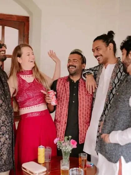 Candid moments of joy are what make an event special. Here, guests laugh and mingle during a wedding celebration, showcasing the relaxed and happy atmosphere we strive to create.