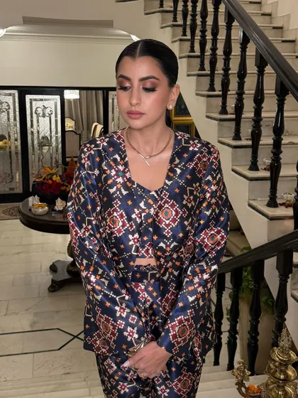 Glowing this Diwali, inside and out. Aishani's stunning bronze makeup and soft pink pout are the epitome of festive chic. This look captures warmth, elegance, and joy.