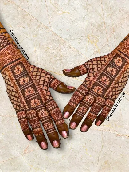 A unique back-hand design with a vertical band of lotus motifs running down the center, framed by a delicate grid pattern.