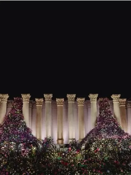 Another perspective of the Roman pillar stage, emphasizing the sheer height and organized pattern of the columns which provide a clean, powerful backdrop.