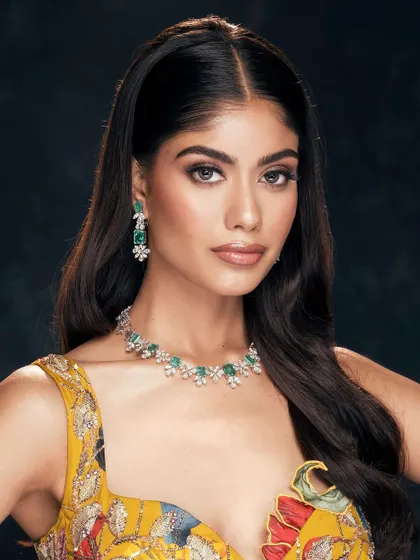 A confident and bright beauty shot, where the model's direct gaze and radiant smile bring life to the image.