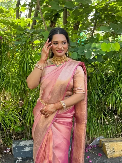 A modern take on a traditional look. This bride chose a beautiful pink silk saree for her engagement, and we paired it with soft, glowing makeup and a simple hairstyle.