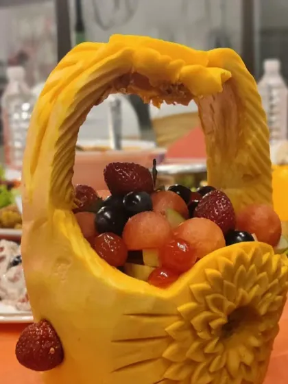 An example of our creative fruit displays. This pumpkin has been carved into an ornate basket, filled with a colourful assortment of fresh fruits. It’s both beautiful and delicious.