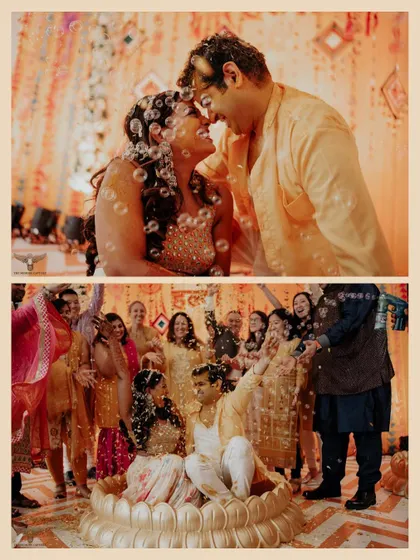 A fun-filled moment from a pre-wedding ritual. The couple is surrounded by bubbles and the happy faces of their loved ones, creating a whimsical and joyful scene.