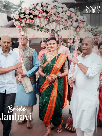 The bride's grand entrance under a phoolon ki chadar. We capture the anticipation and tradition of the bridal entry in our Maharashtrian wedding photography.