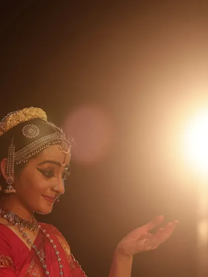 An artistic shot where I interact with the stage light, symbolizing the divine light of the deity. This was a special moment during the "Venkatesha Shreesha" performance.