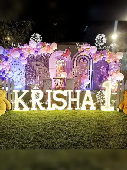 A complete view of the charming butterfly garden party setup, with two large teddy bears adding a cute and cuddly touch.
