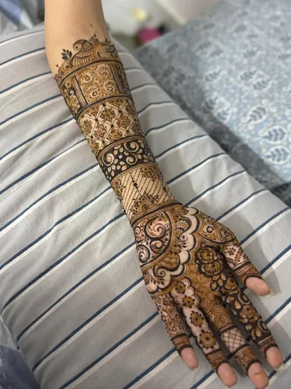 This is a detailed view of my intricate bridal henna work. Each design is unique, combining traditional patterns like paisleys and mandalas with fine-line fillers to create a stunning, full-coverage look for your special day.