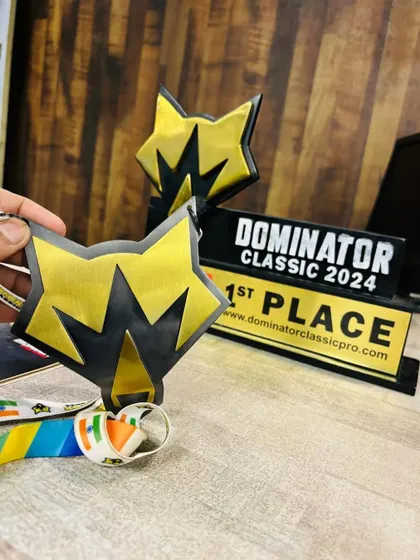 The hardware that proves the hard work. This first-place trophy from the Dominator Classic 2024 is a symbol of our commitment to excellence in bodybuilding coaching.