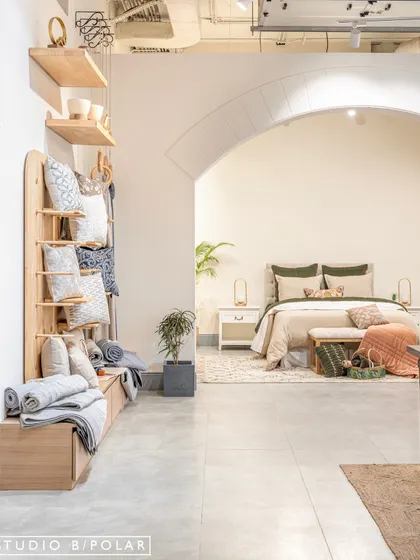 The flexible display system we designed for FA Home allows for an organized yet soft presentation of textiles. The light wood and clean lines of the shelving ensure the colorful and textured products remain the focus.