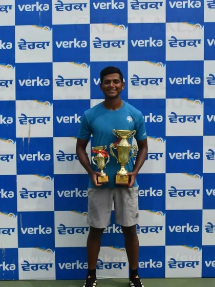 Ishaque Eqbal with his singles winner and doubles finalist trophies from the AITA 1 Lakh in Chandigarh.