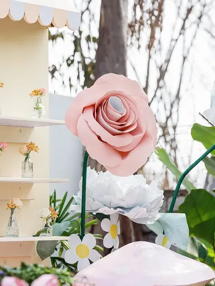 A close-up of the intricate paper flowers and the miniature flower arrangements on the display shelves. I pay close attention to craftsmanship to ensure every detail is beautiful.