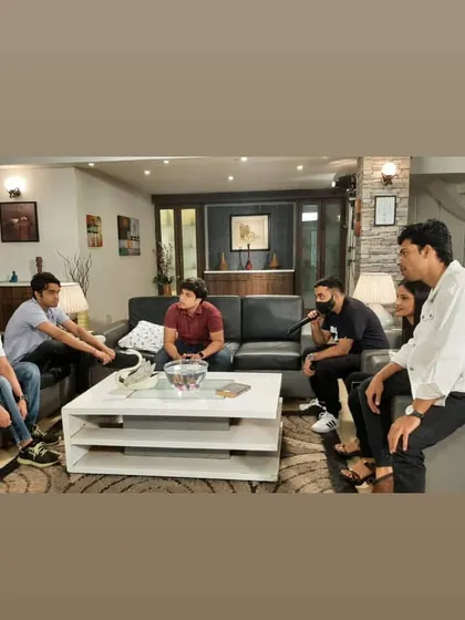 The cast and crew discussing a scene. Collaboration is everything in this field, and I always make sure to work closely with the director and the entire mandali to get the perfect shot.