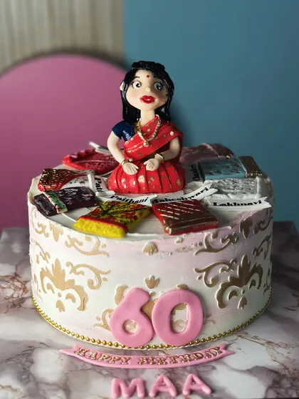 To the mom who wears her sarees with grace. This special cake for a 60th birthday celebrates a mother's love for her beautiful sarees, with edible miniatures of her favorites.