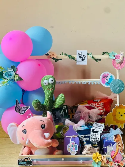 Another angle of the baby shower cart, showing the cute animal cutouts and decorative elements that bring the theme to life.
