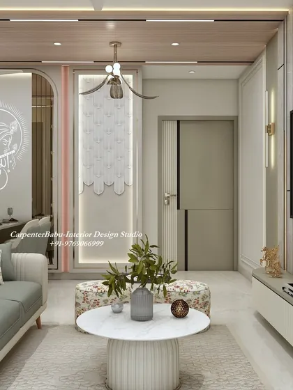 The living room at Ashar Axis, showing the connection to the dining area with its Krishna-themed glass partition. The design is open, airy, and full of thoughtful details.