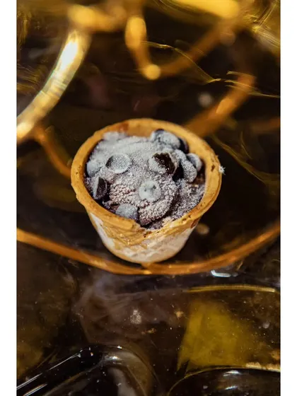 When life gives you lemons, ask for chocolate. A close-up of the mini chocolate chip ice cream cone, a perfect bite-sized dessert.