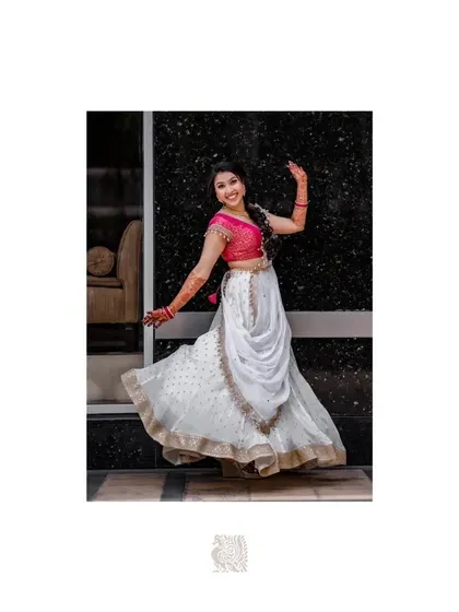 A solo twirl for the bride. We can incorporate moments for each of you to shine individually within your couple's dance, highlighting your grace and the beauty of your wedding attire.