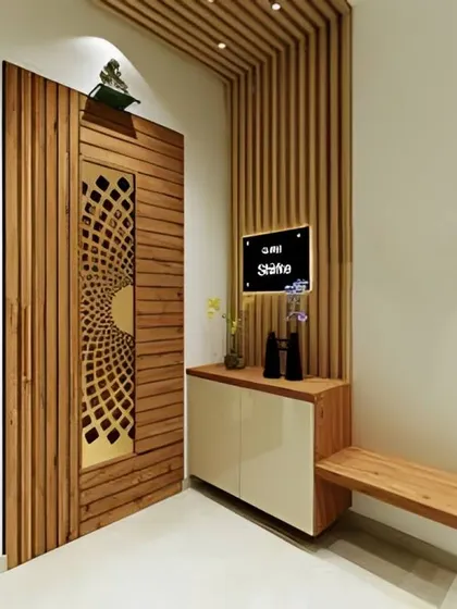 A modern entryway with a slatted wood door and a matching accent wall. The design includes a small bench and a floating console, creating a clean and minimalist look.