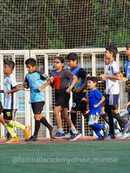 Players of different ages run together, showcasing the community feel of the academy. Fitness is a collective effort here.