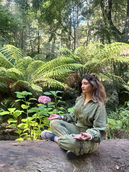 Meditating in a lush forest in Australia. Taking time to sit in nature, connect with my breath, and feel the 'Om' within is essential to my practice.