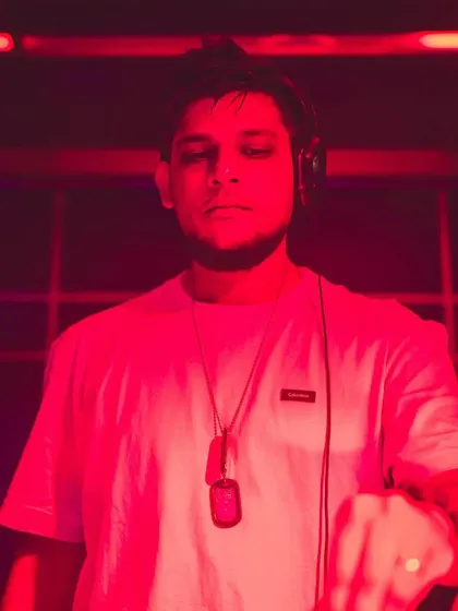 A still shot from a Friday night gig, bathed in red light. This captures the focus and intensity of a live performance.