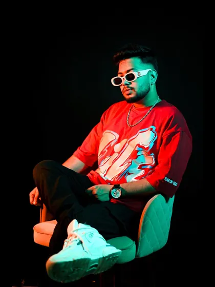 A relaxed but confident pose. The glow isn't just the lights; it's the passion for the music.