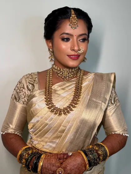 I believe in enhancing features, not changing skin tones. My beautiful bride Archana is a perfect example, with a flawless airbrush makeup look that matches her skin perfectly.