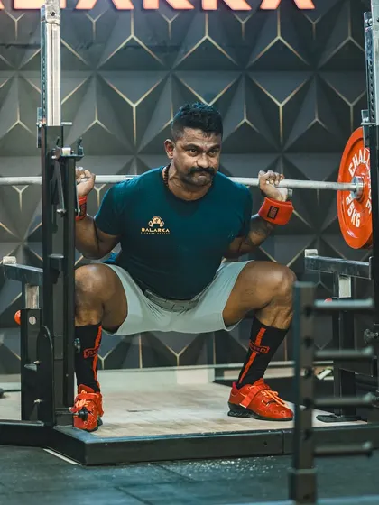 Day 9 of 99. A moment of focus before a squat. Strength is not just physical. It's about surrendering to a higher power, trusting the process, and staying grounded in your faith.